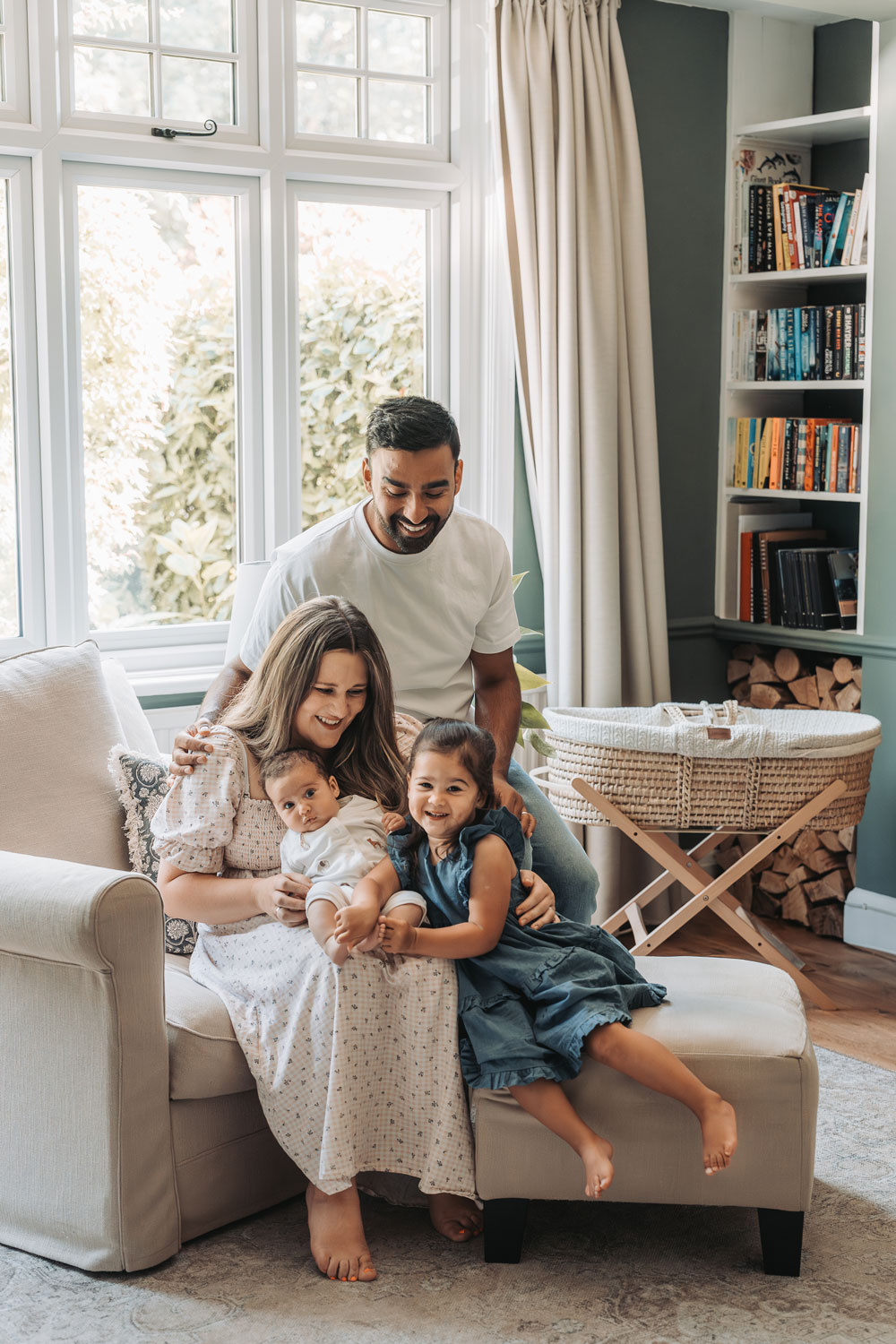 the-corbett-creative-family-newbown-wedding-photography-warwickshire-19 Family sat smiling in living room at in home newborn photoshoot by The Corbett Creative Photography