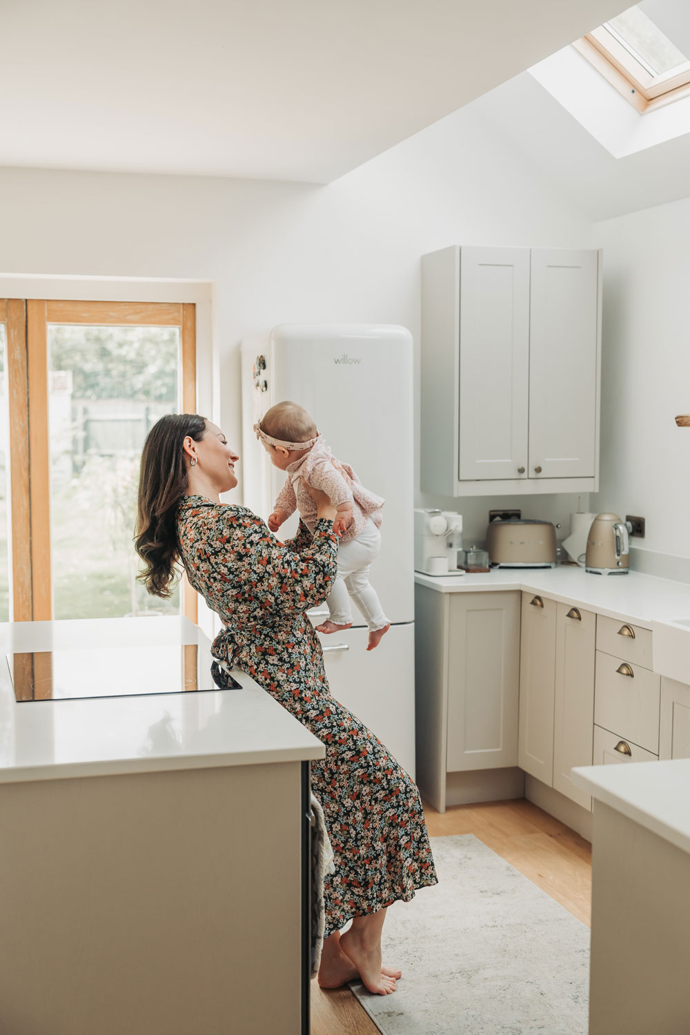 Warwickshire in home family photoshoot with mum and baby stood in kitchen