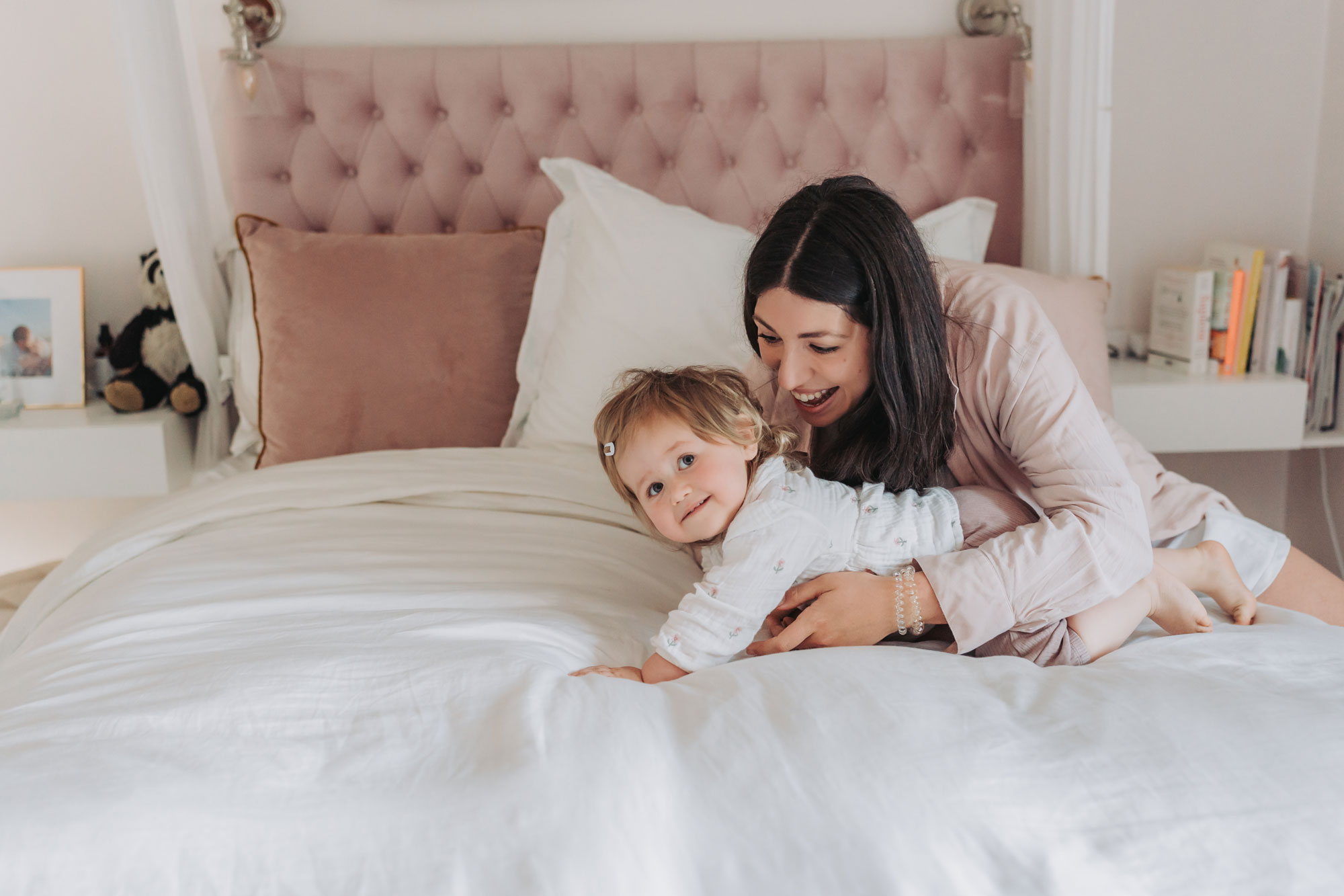 Leicestershire in home family photoshoot with toddler girl on bed with mum