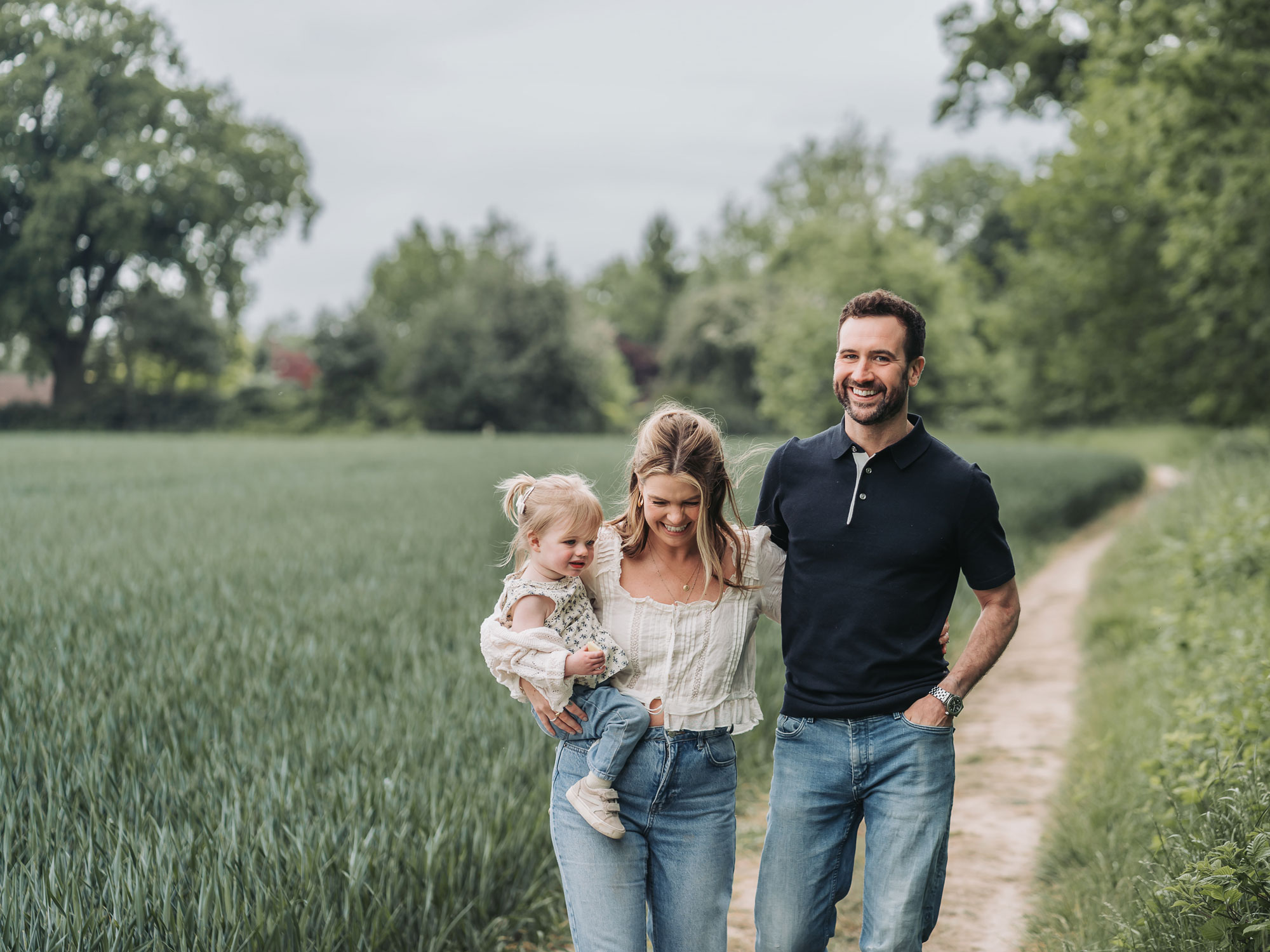 Warwickshire crop field photoshoot with family walking laughing