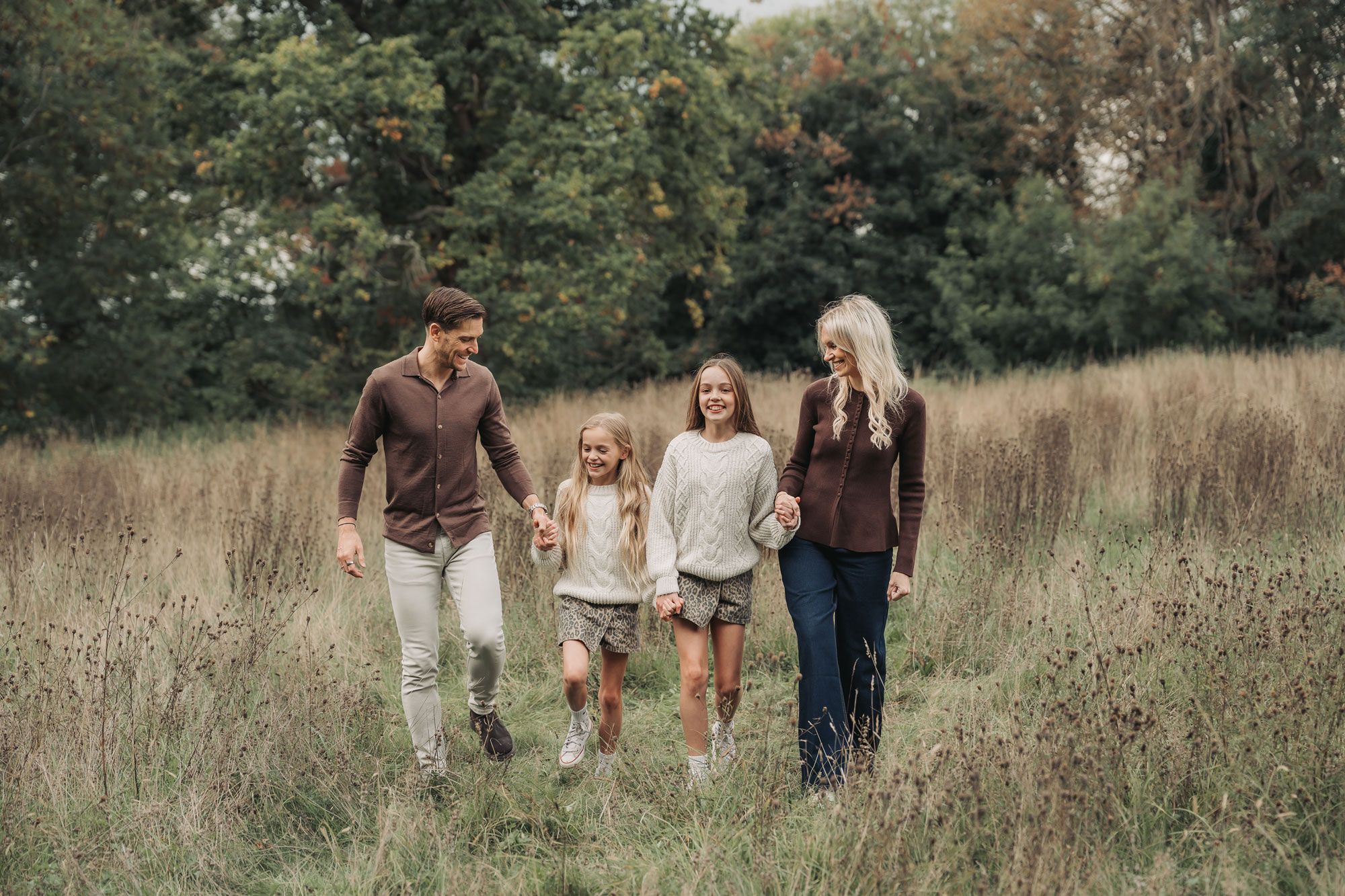 Photo from extended family photoshoot in Solihull park with family with two girls holding hands