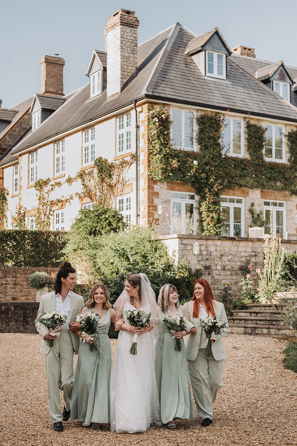 Longbourn estate barn wedding group photo of bridal party with house in the background