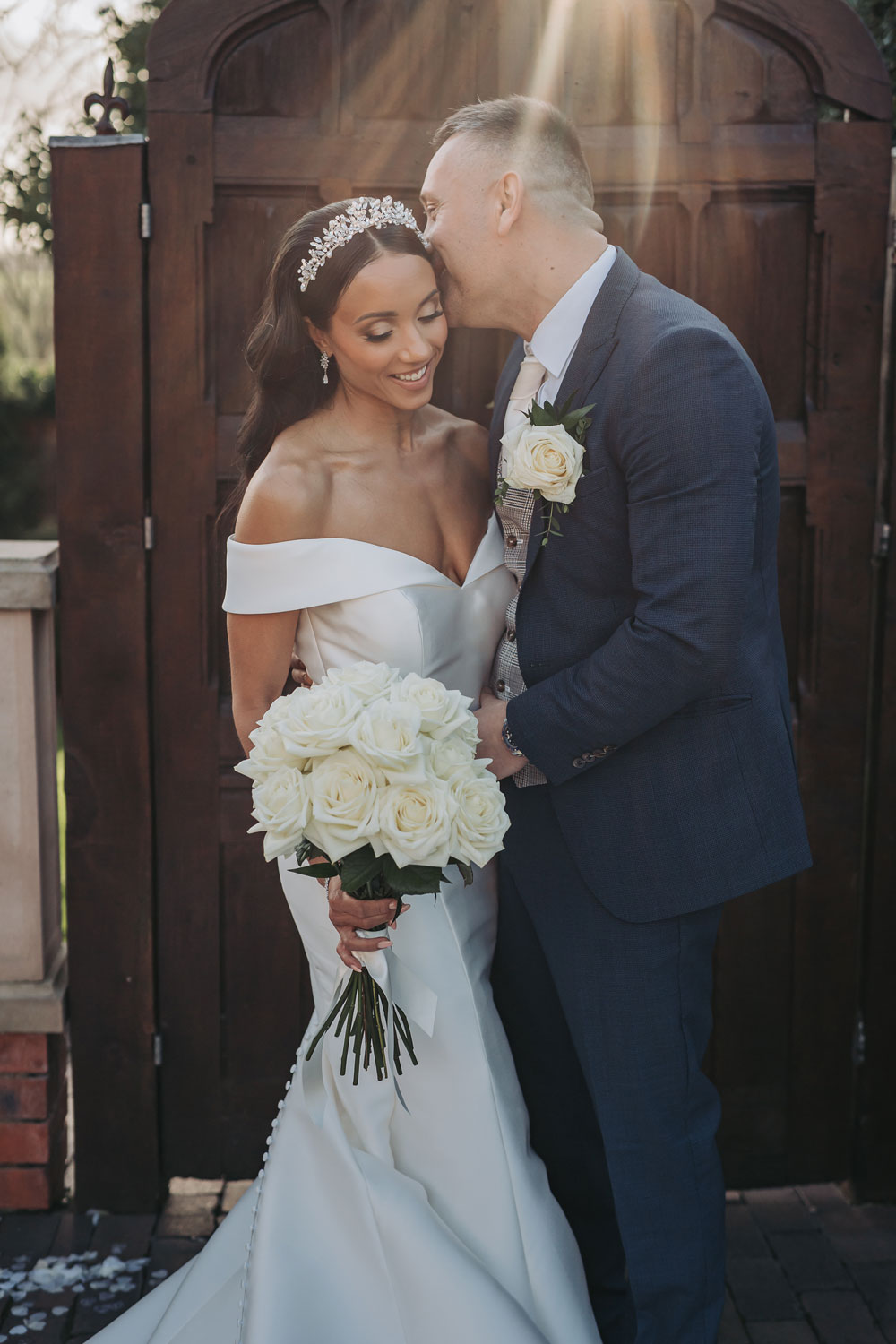 Wedding portrait with bride wearing off the shoulder dress
