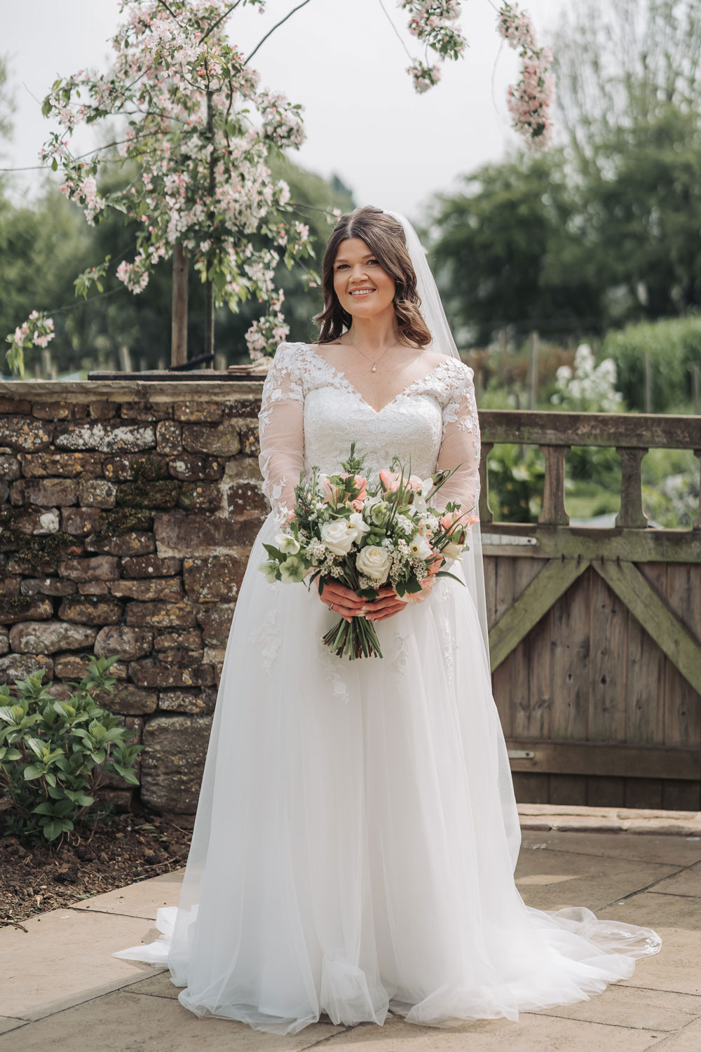 Bridal portrait in the garden with blossom tree