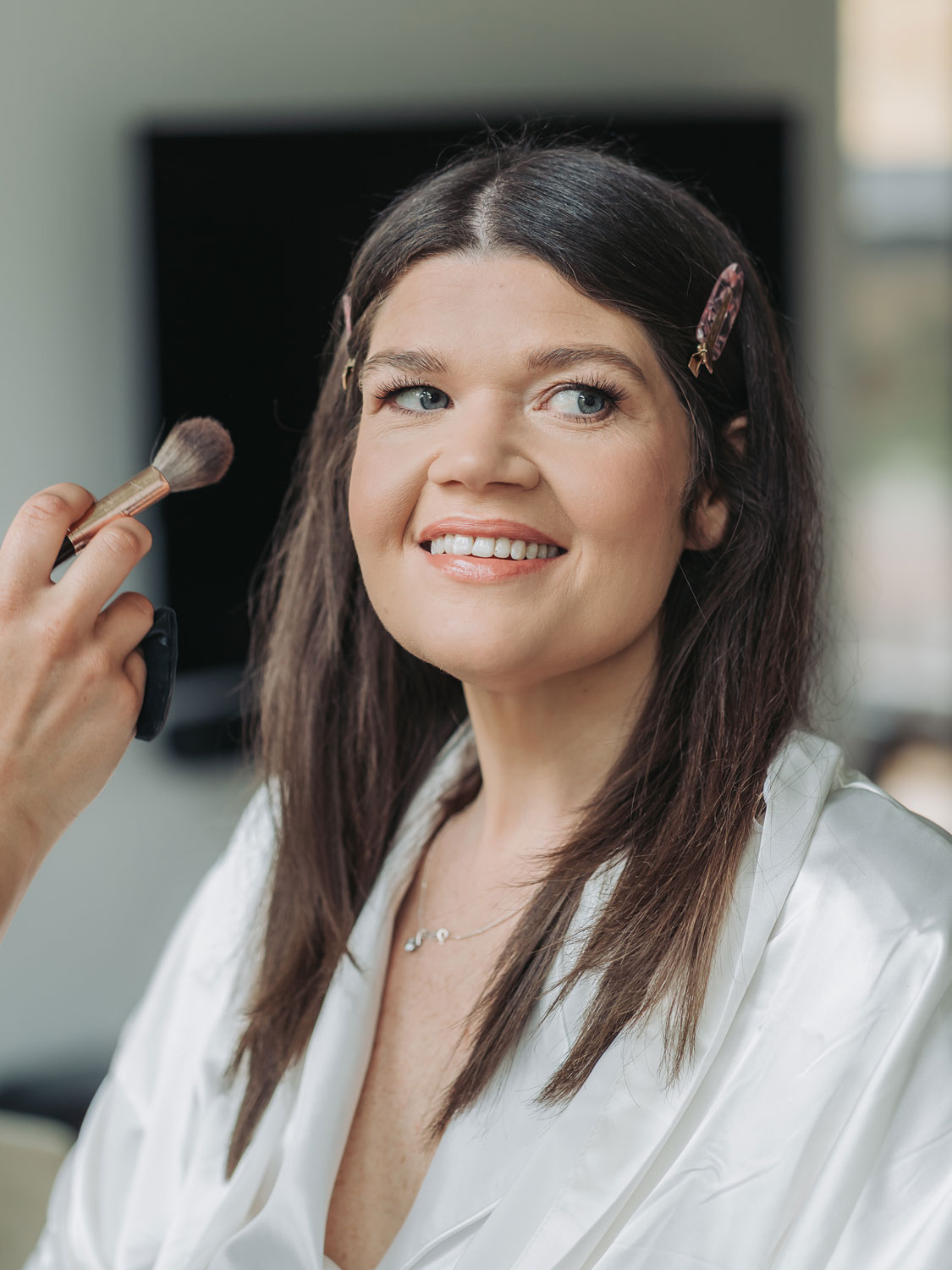 Smiling bridal portrait of make-up