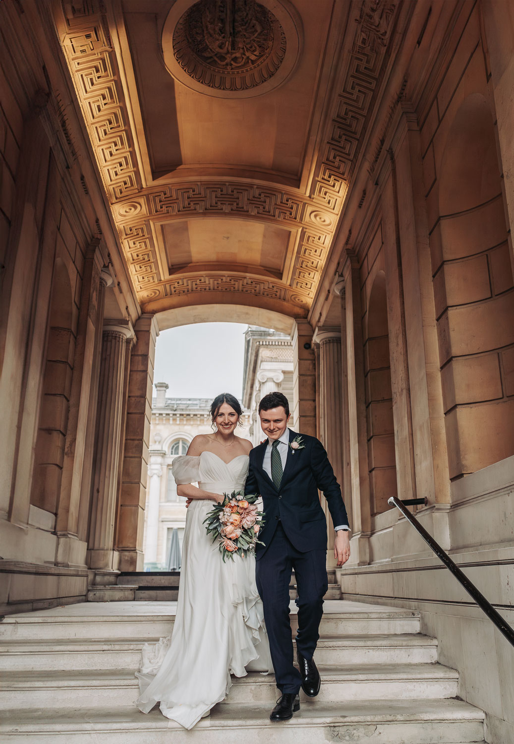 Wedding couple portraits down the stairs outside Ashmolean wedding venue
