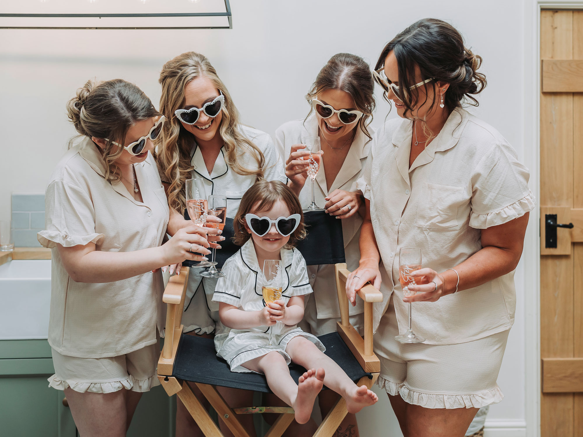 Bridesmaids and flower girl in pyjamas and sunglasses at Crockwell Farm