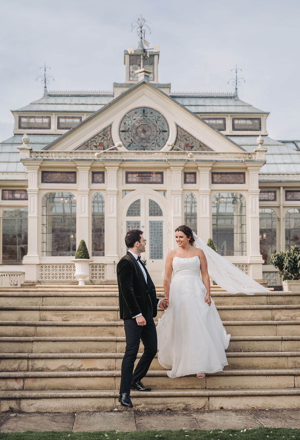Kilworth house wedding with couple walking down the steps outside of the orangery