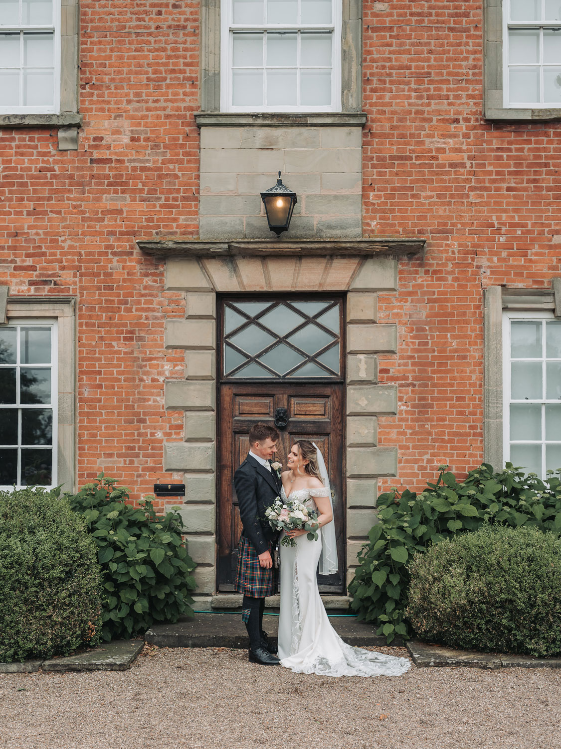 Couple portrait at front door of Sherbourne Park wedding venue