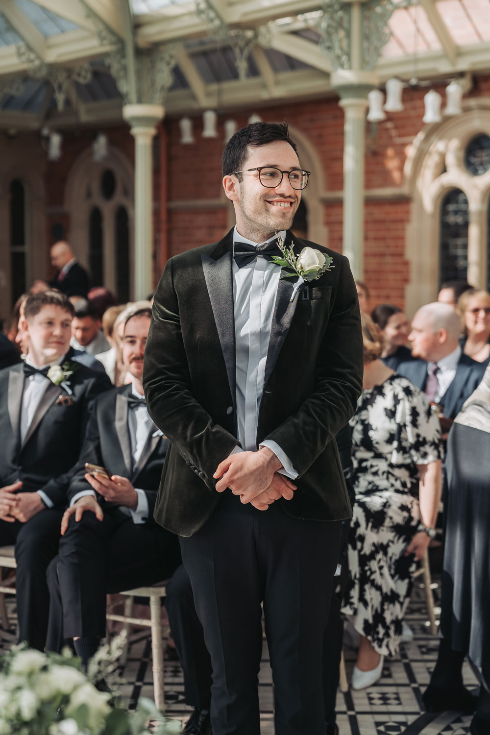 Kilworth house black tie wedding with groom stood in the ceremony in the orangery