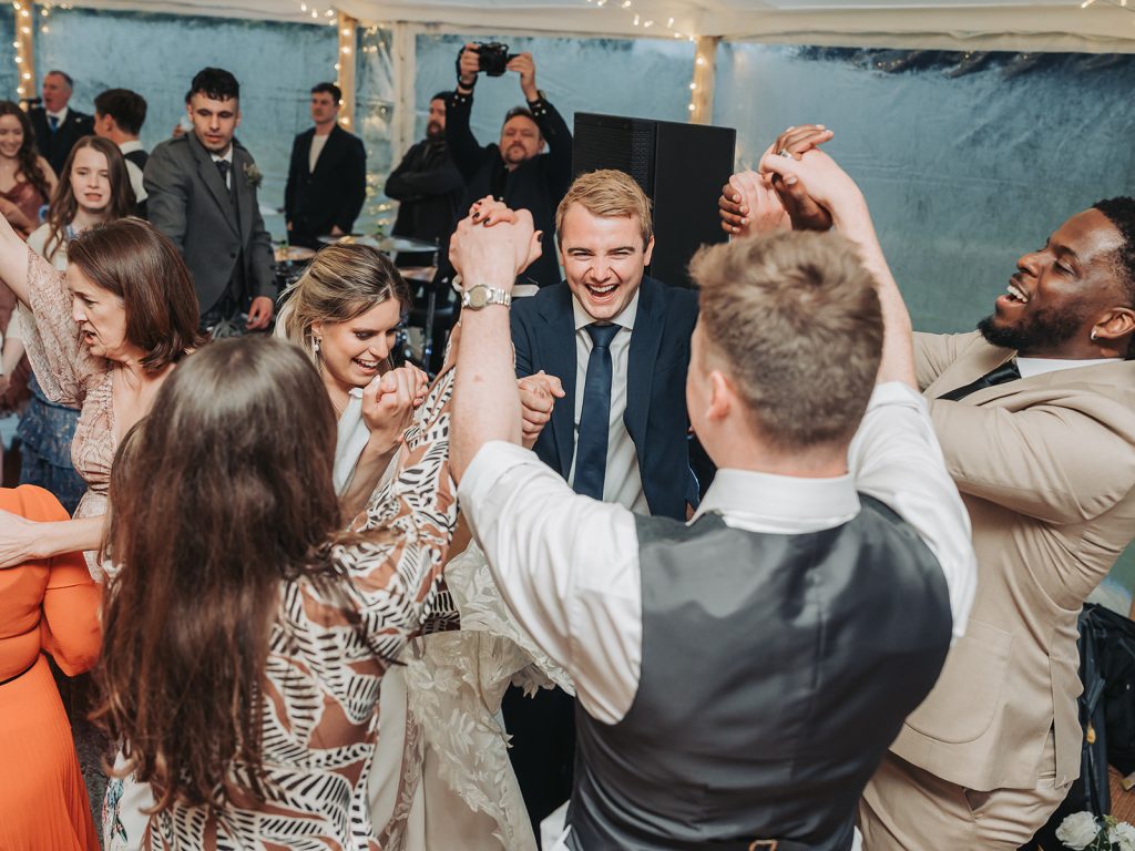 Wedding guests enjoying a cèilidh