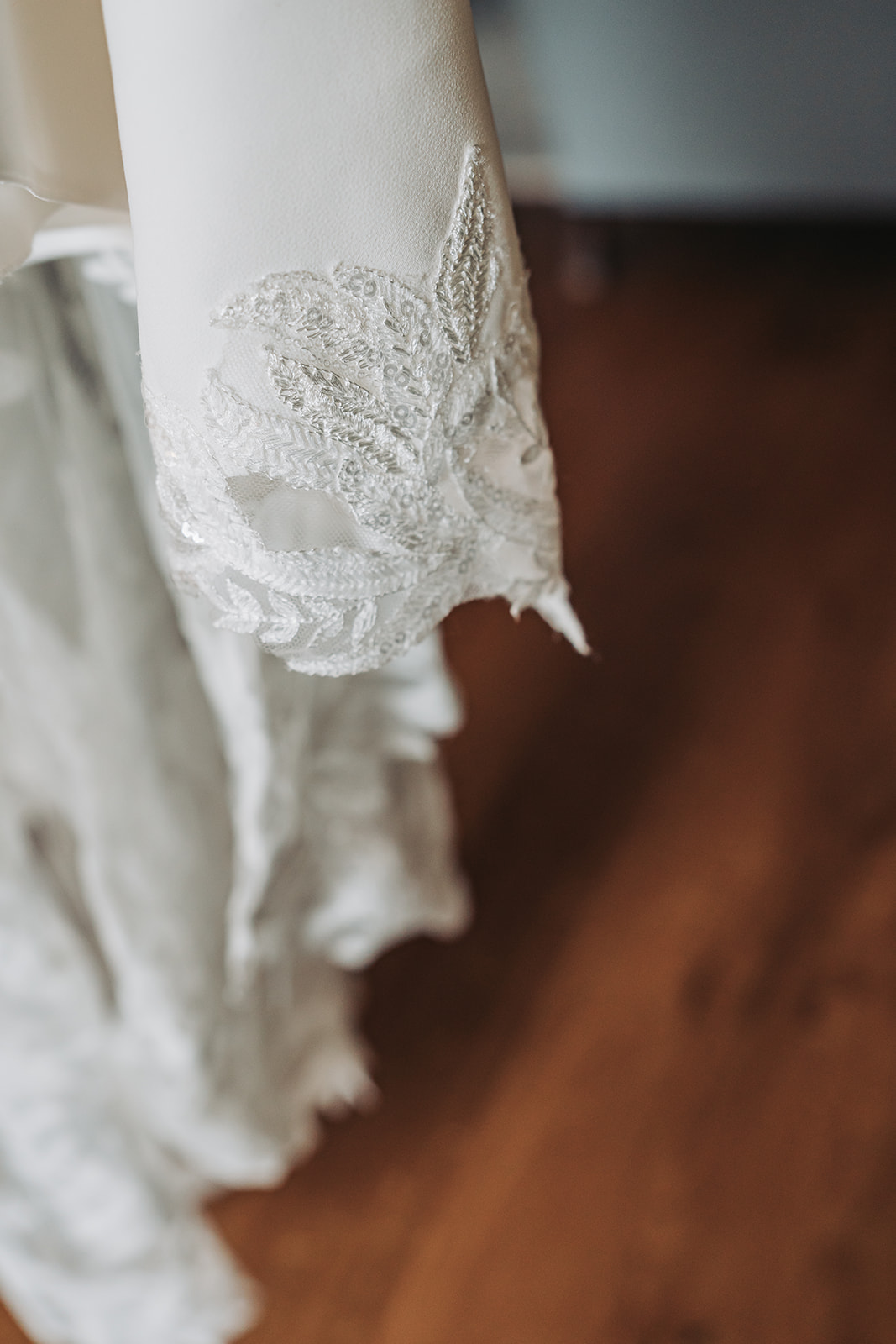 Detail shot of lace leaf detail wedding dress
