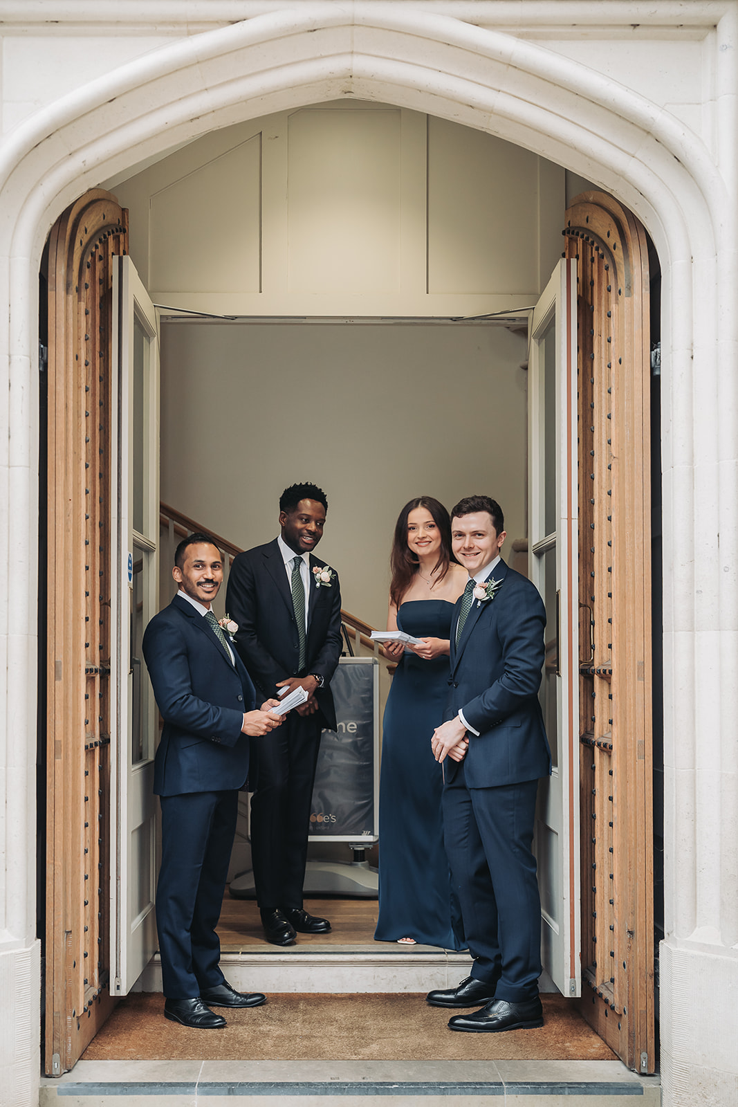 Grooms party stood in doorway of St Ebbe's church Oxford