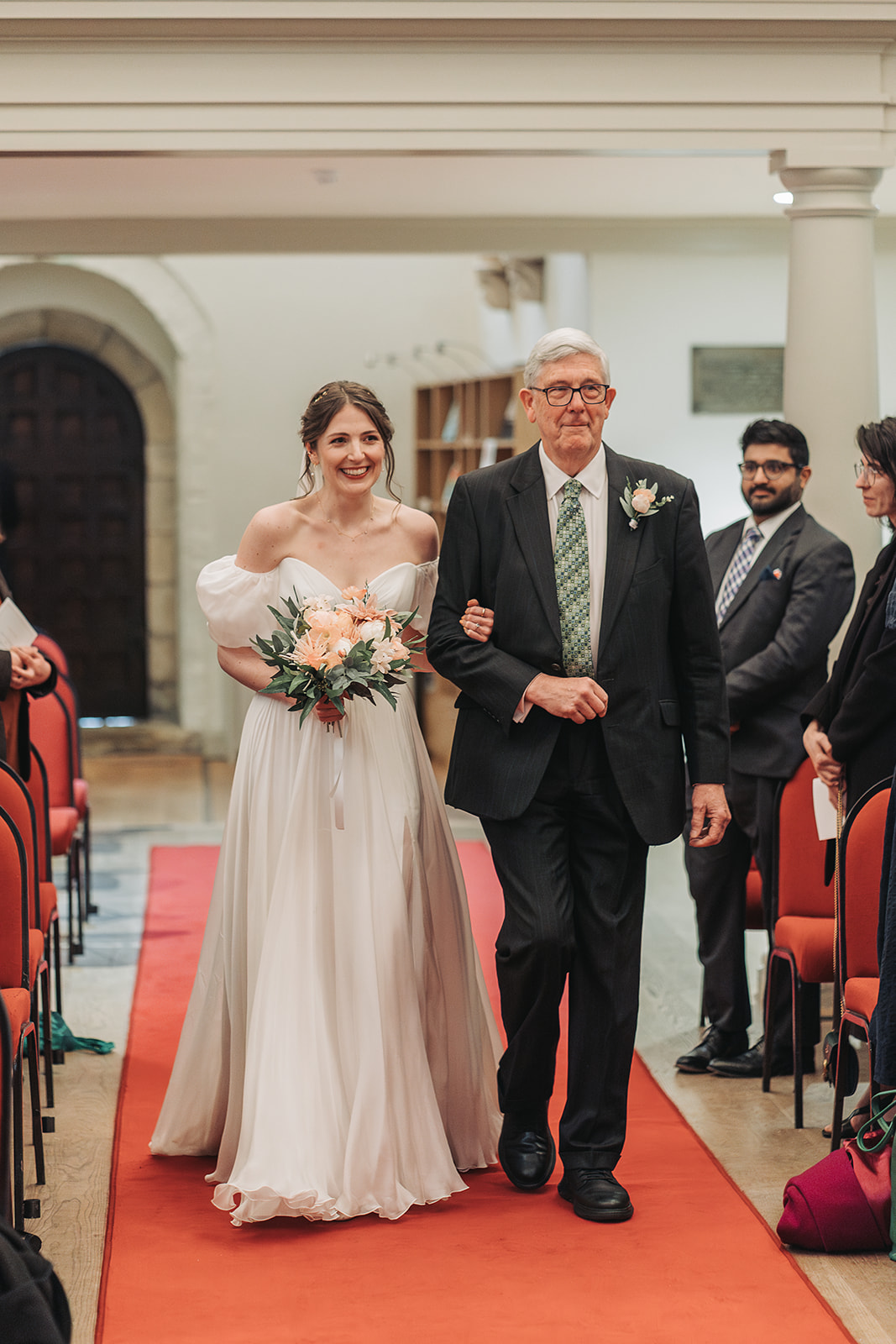 Bride walking down the aisle of St Ebbe's Church Oxford