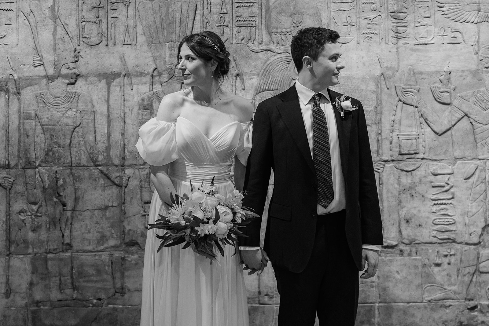Wedding portrait in front of Egyptian wall at Ashmolean Museum