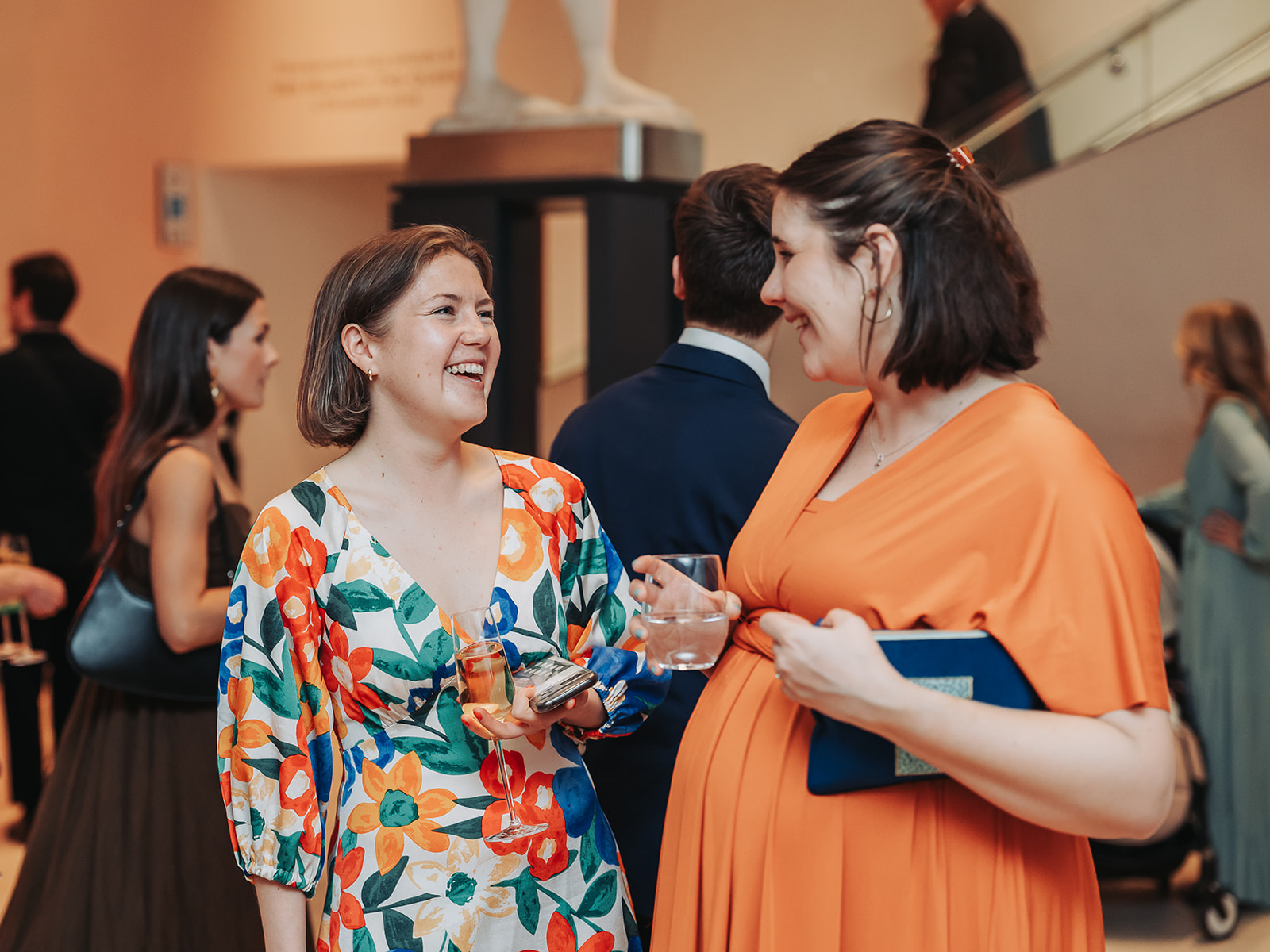 Wedding guests laughing together at Ashmolean museum