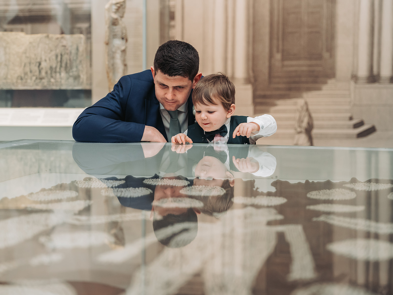 Dad and child looking at artefacts at Ashmolean museum