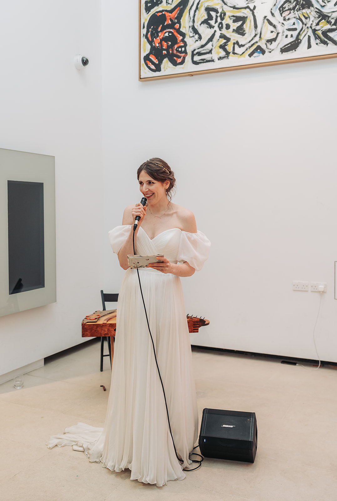 Bride giving speech in atrium at Ashmolean museum