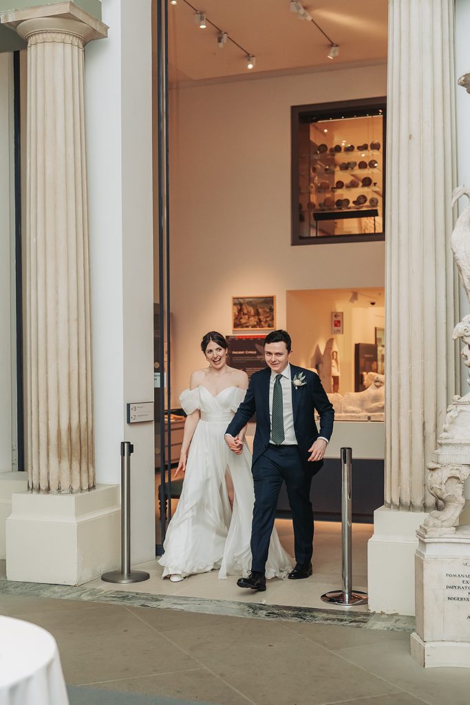 Bride and groom walking into dinner