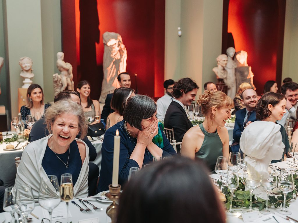 women sat at table laughing