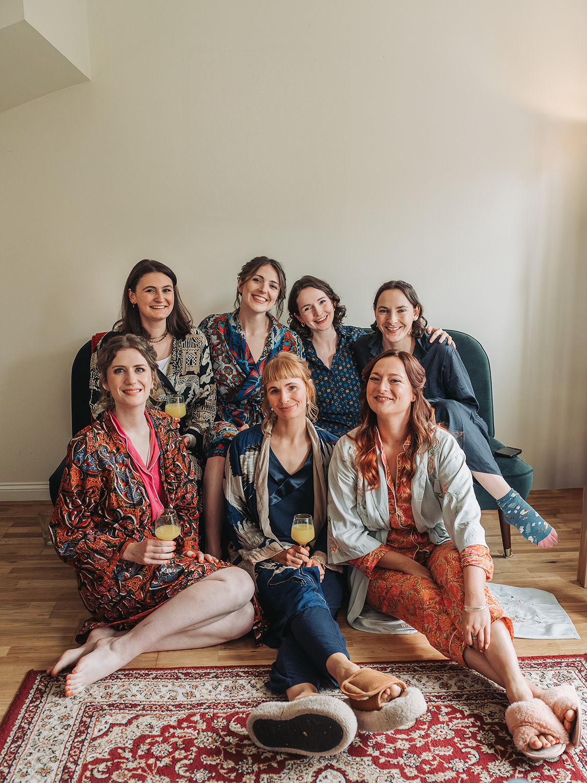 Bridesmaids group shot wearing colourful dressing gowns