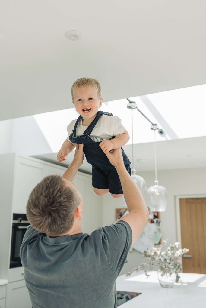 toddler boy flying in the air