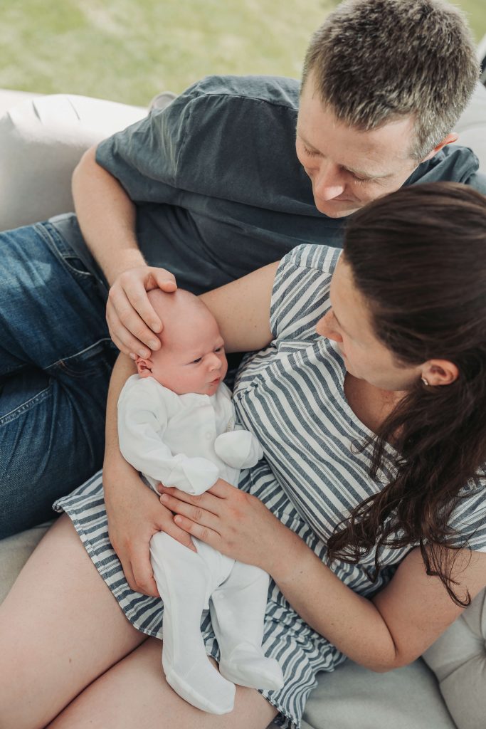 Shot from above baby in mum and dad's arms