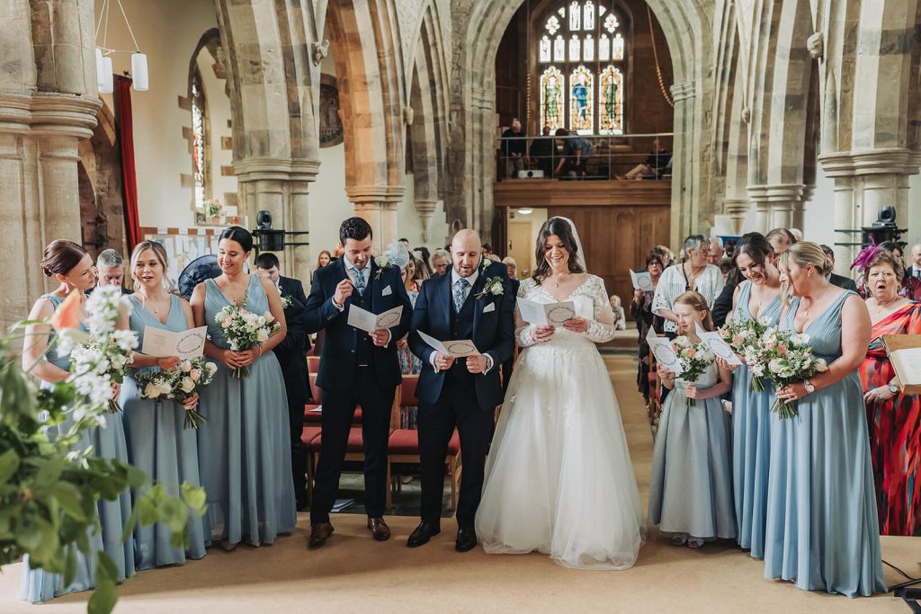 Wedding party in Northamptonshire church singing