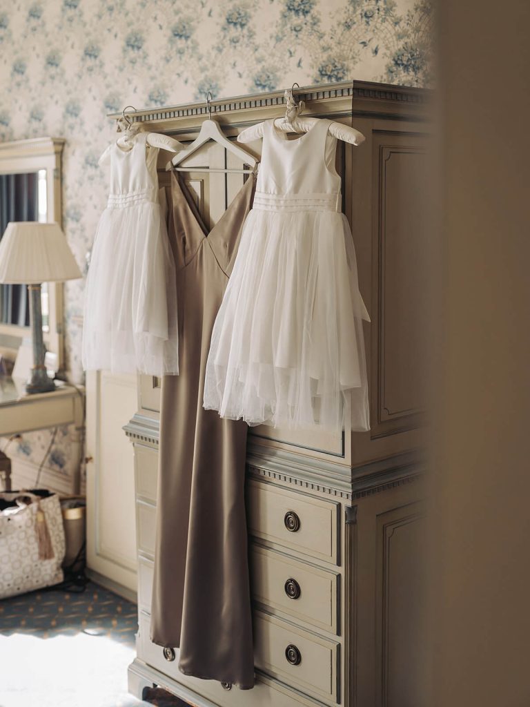 brown bridesmaid dress next to flower girl dresses