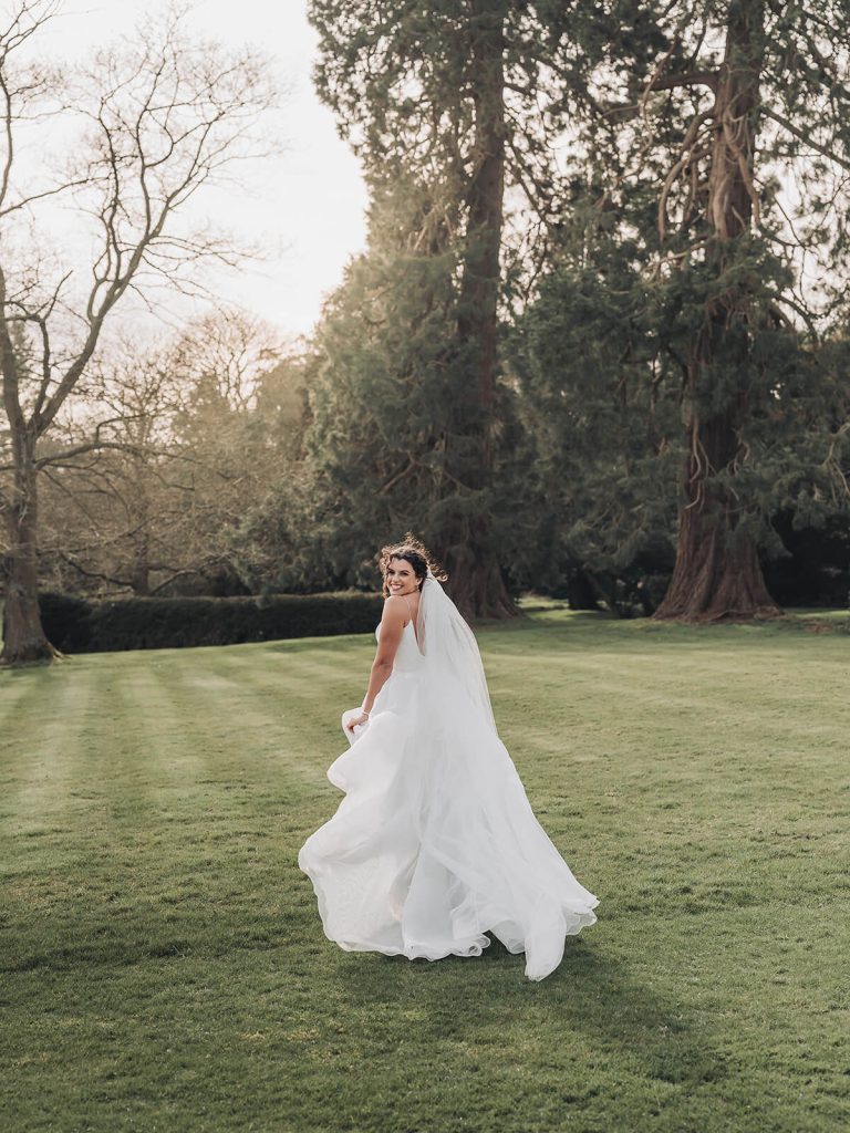 bridal portrait of bride running at Kilworth House