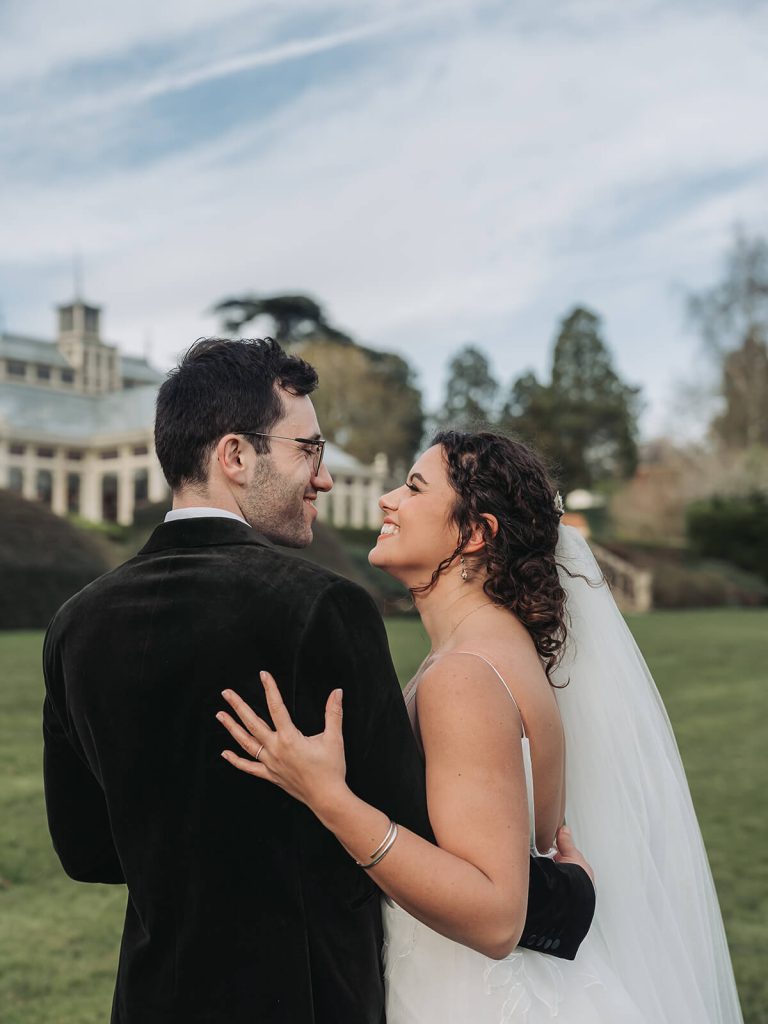 bride and groom smiling and hugging at Kilworth House