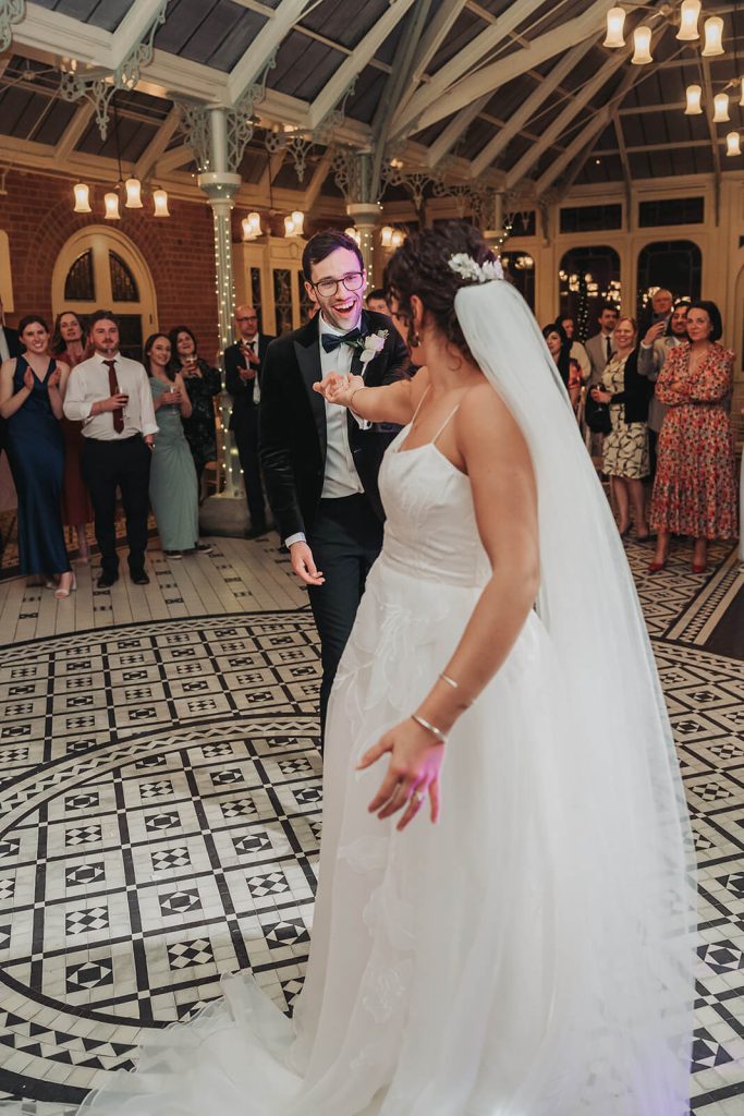 groom twirling bride on dancefloor at Kilworth House wedding