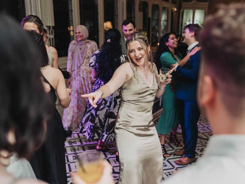 bridesmaid on Kilworth House dancefloor smiling