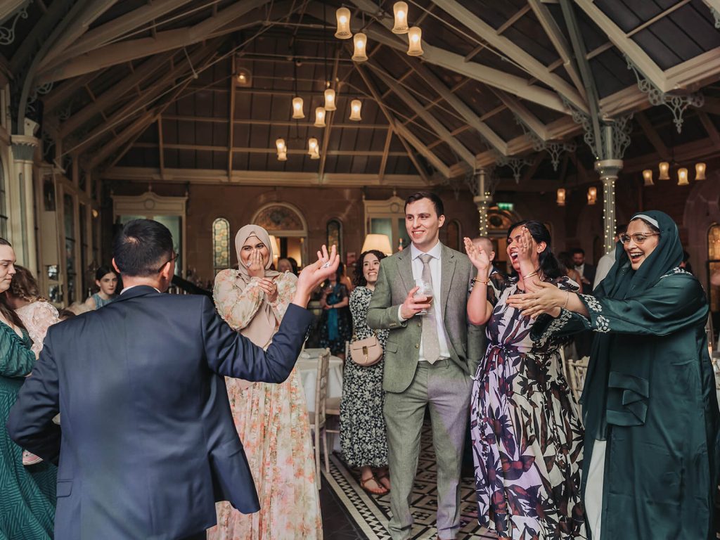 wedding guests on dancefloor at Kilworth House wedding laughing and clapping
