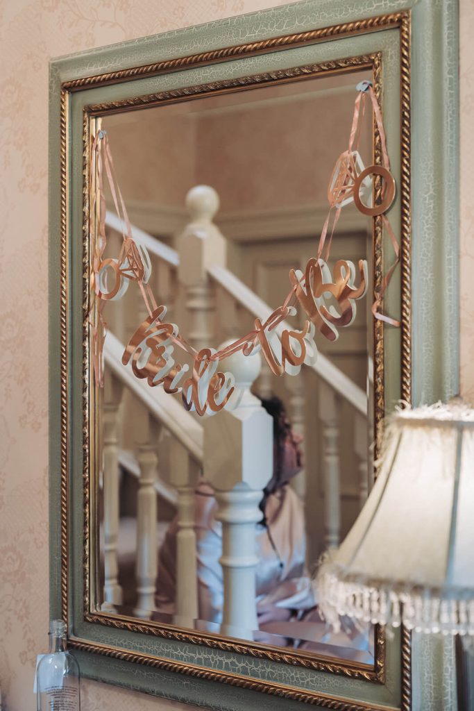 'bride to be' sign hanging on mirror at Kilworth House