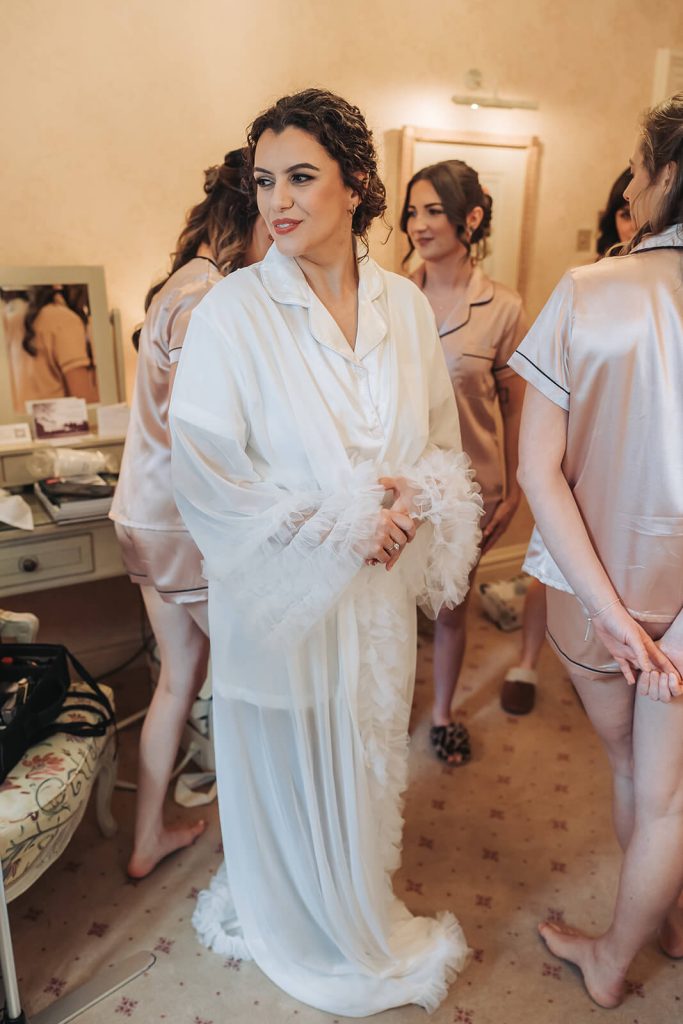 bride wearing ruffled dressing down