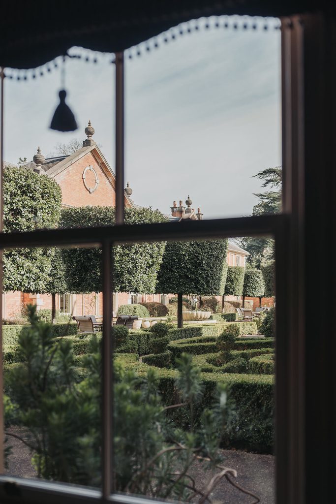 view through window of knot garden at Kilworth House wedding venue