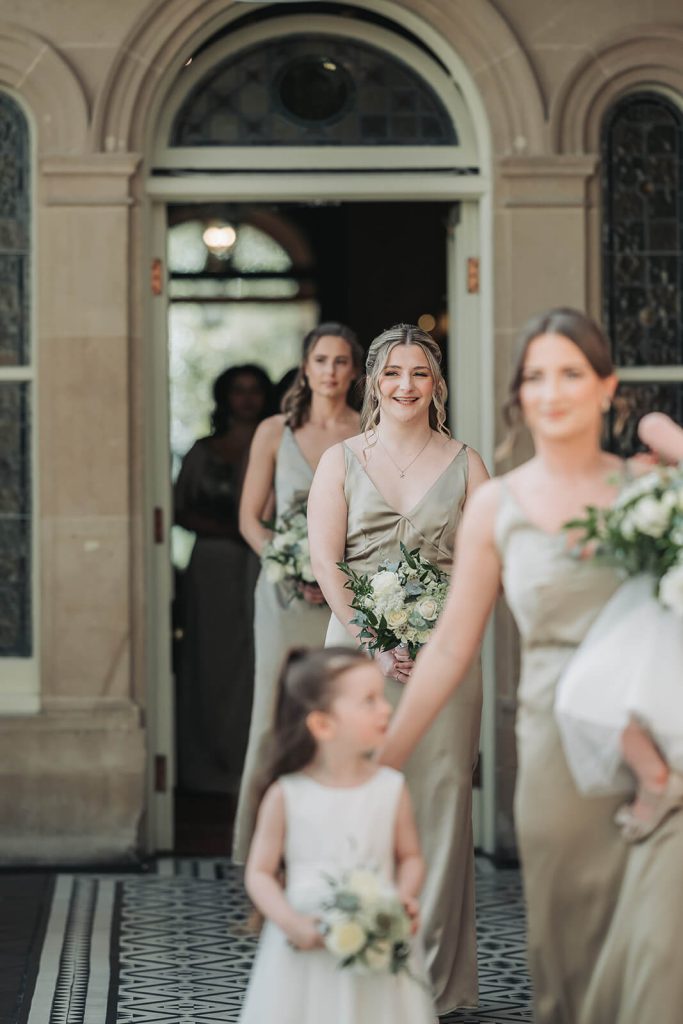 bridesmaids walking into room
