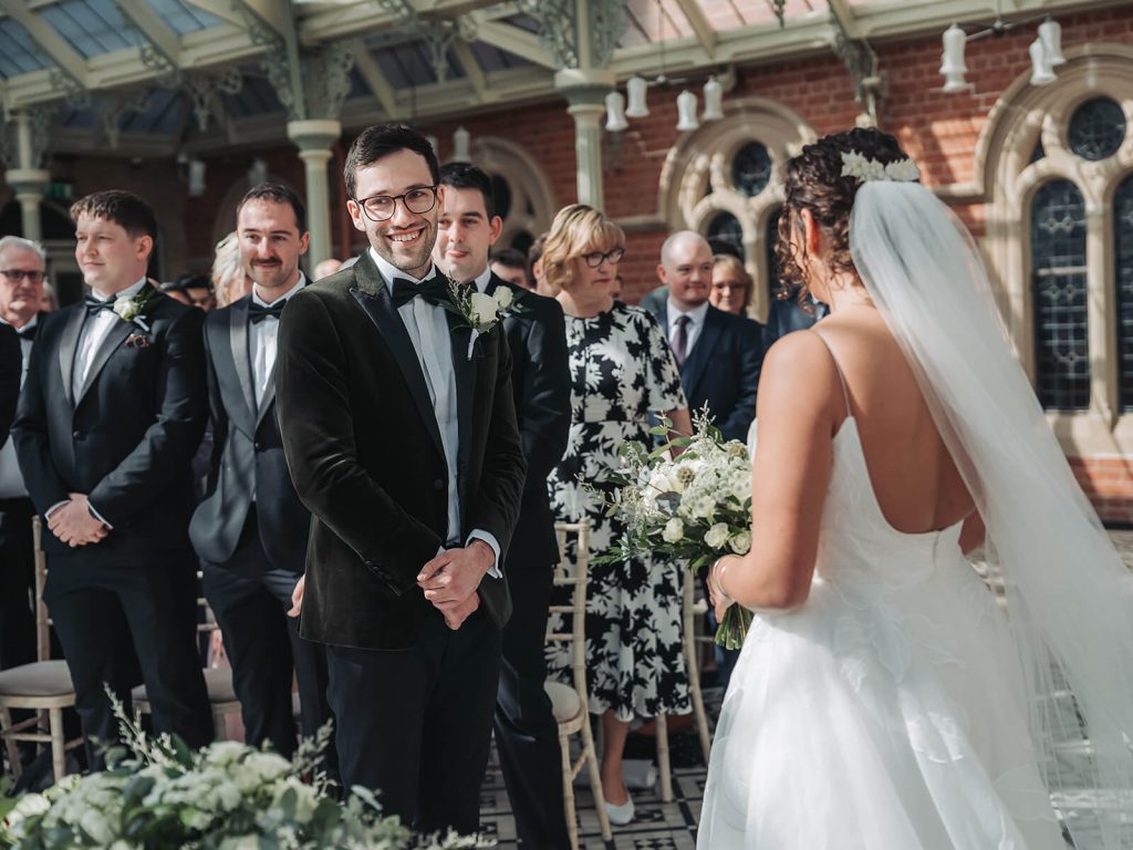 groom smiling in ceremony at Kilworth House