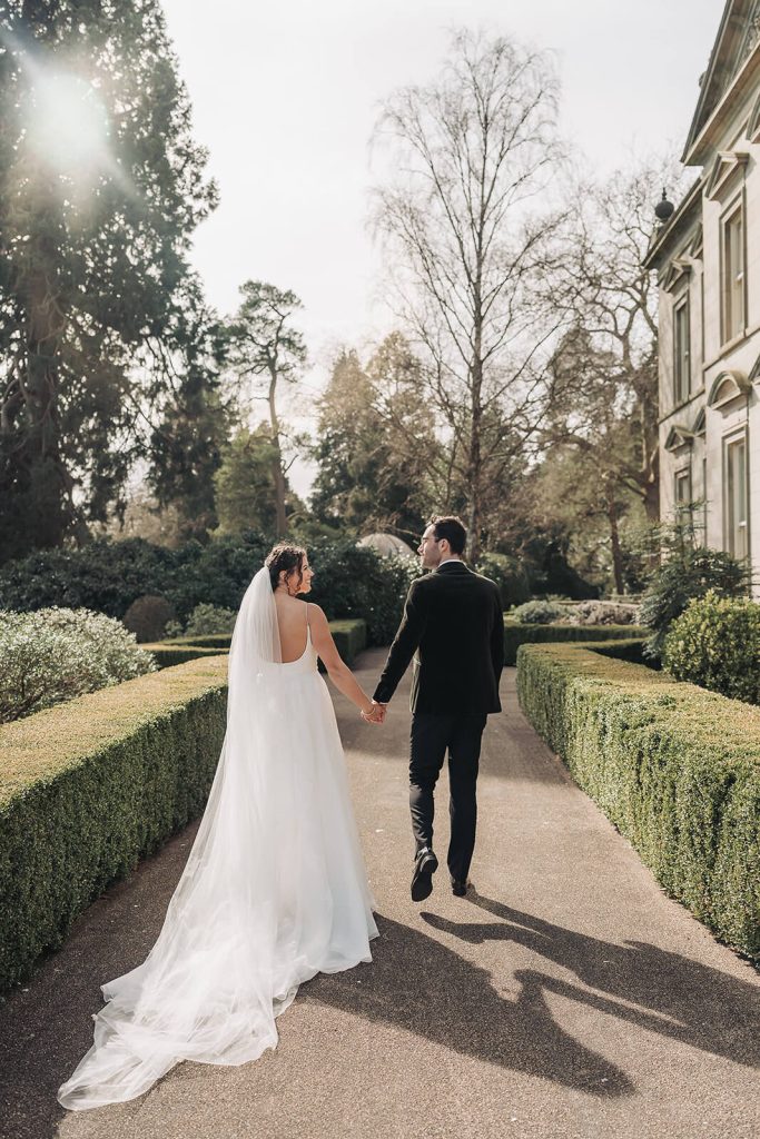 Couple walking away holding hands