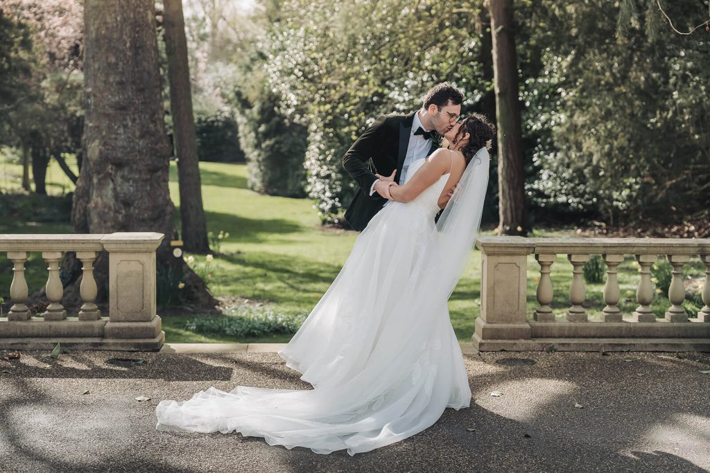wedding couple dip outside of Kilworth House