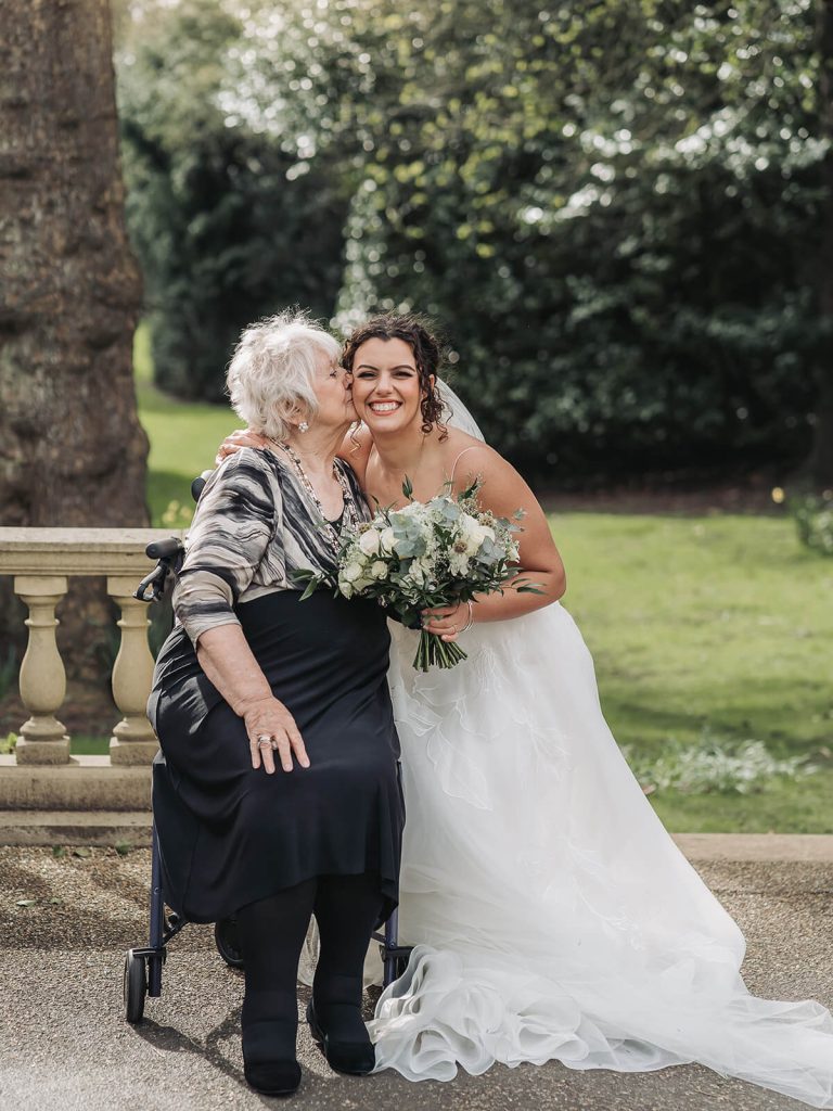 grandma kissing bride