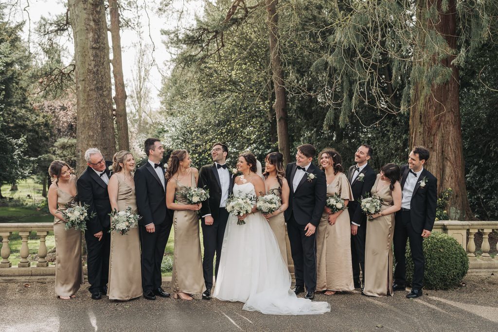 Wedding party laughing at Kilworth House