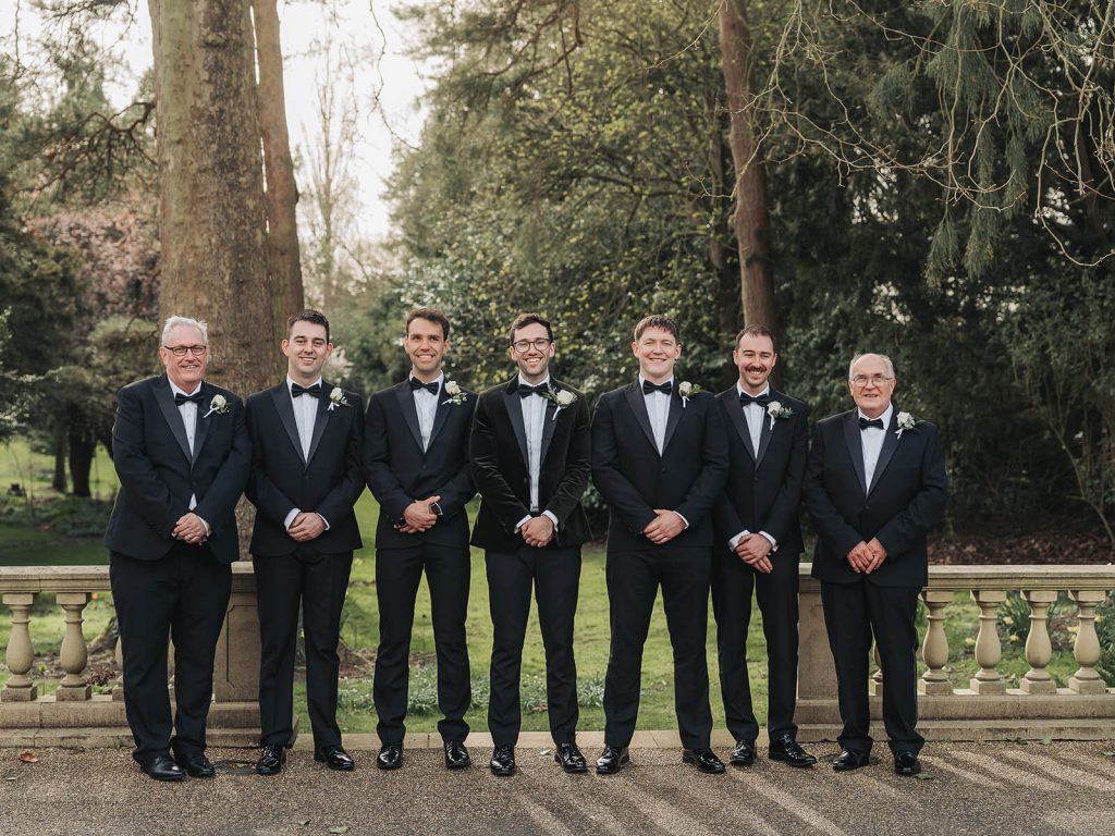 groomsmen group shot wearing tuxedos