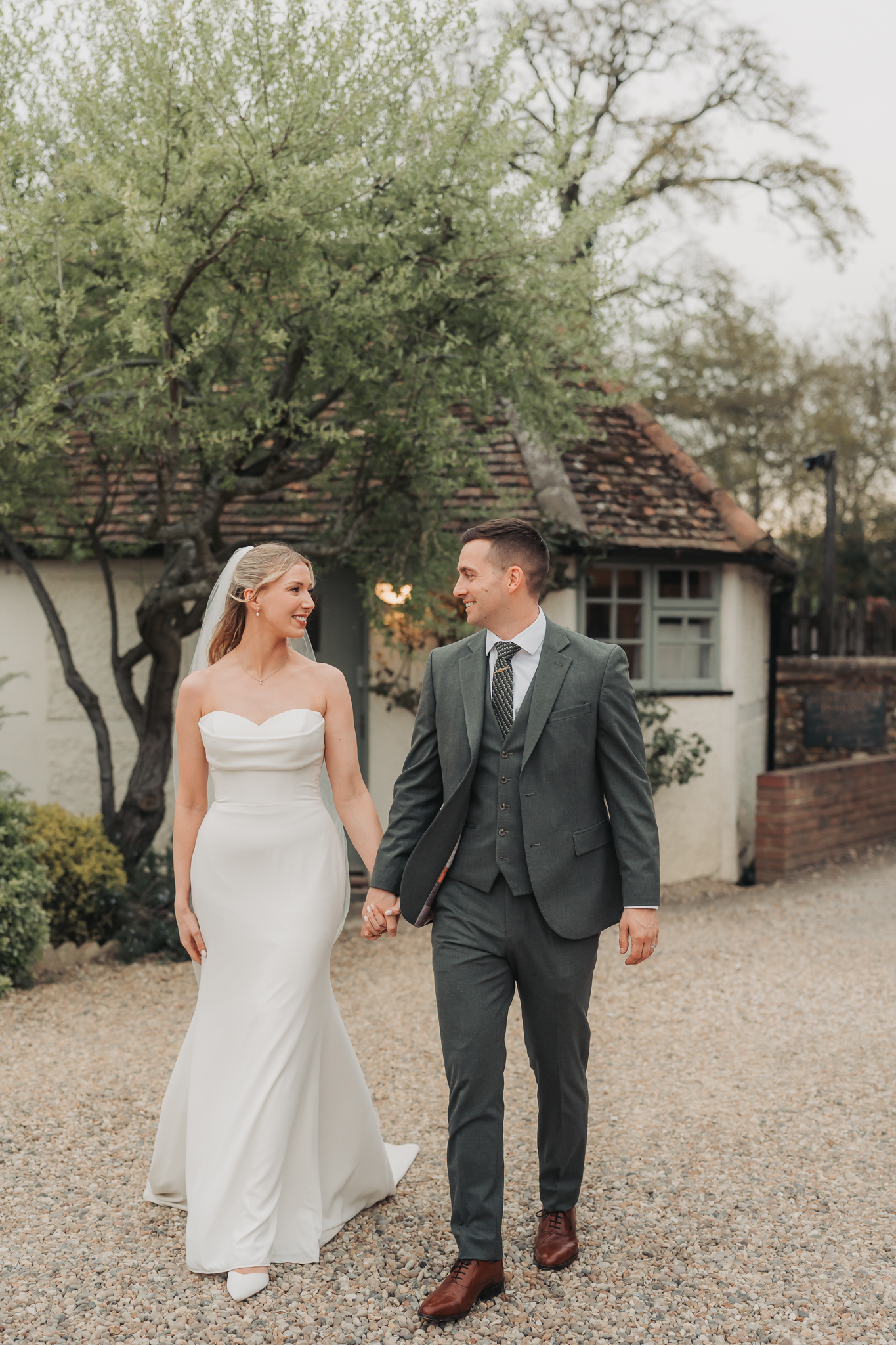 bride and groom walking hand in hand