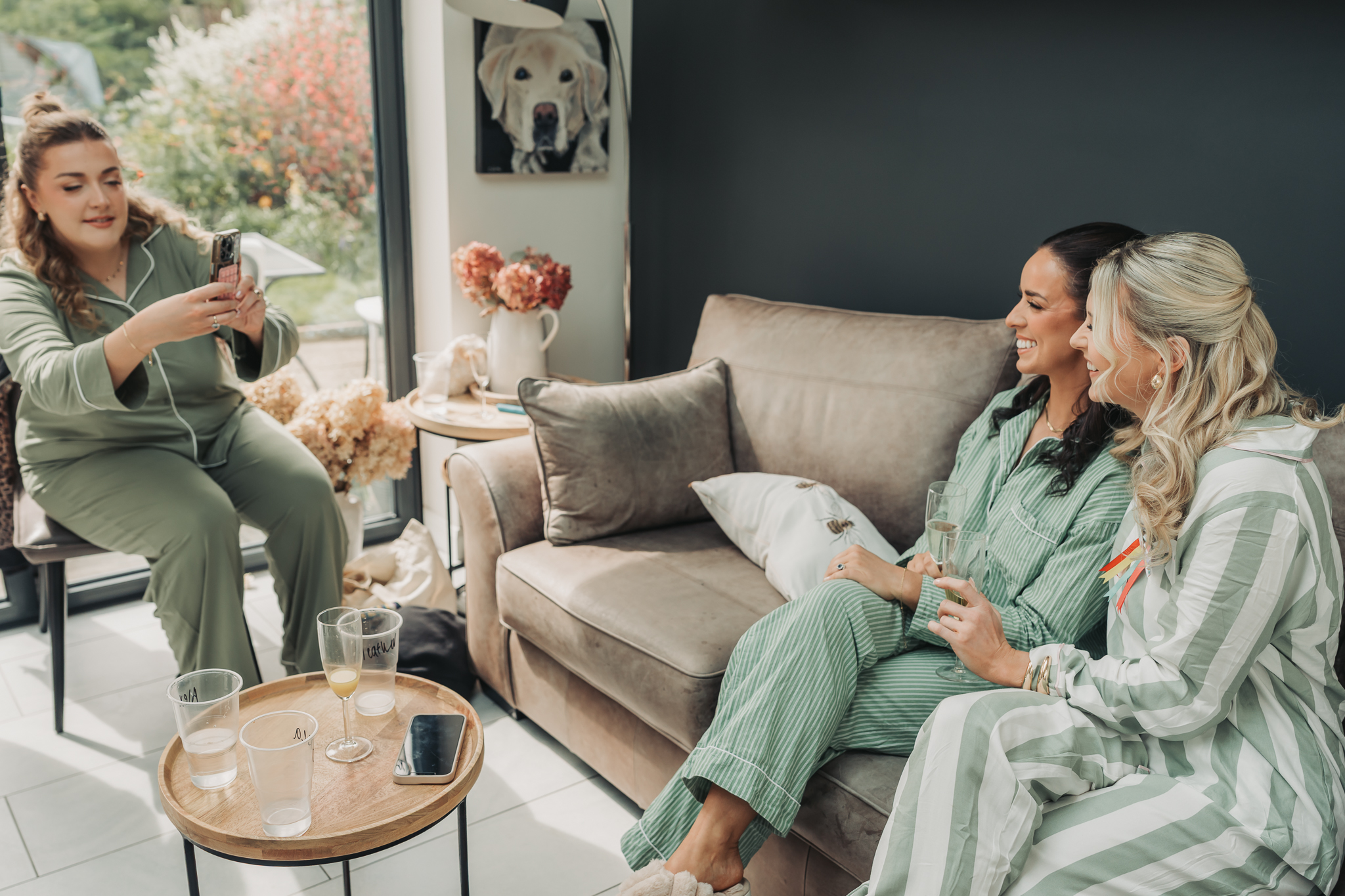 bridesmaids in green pyjamas having photo taken