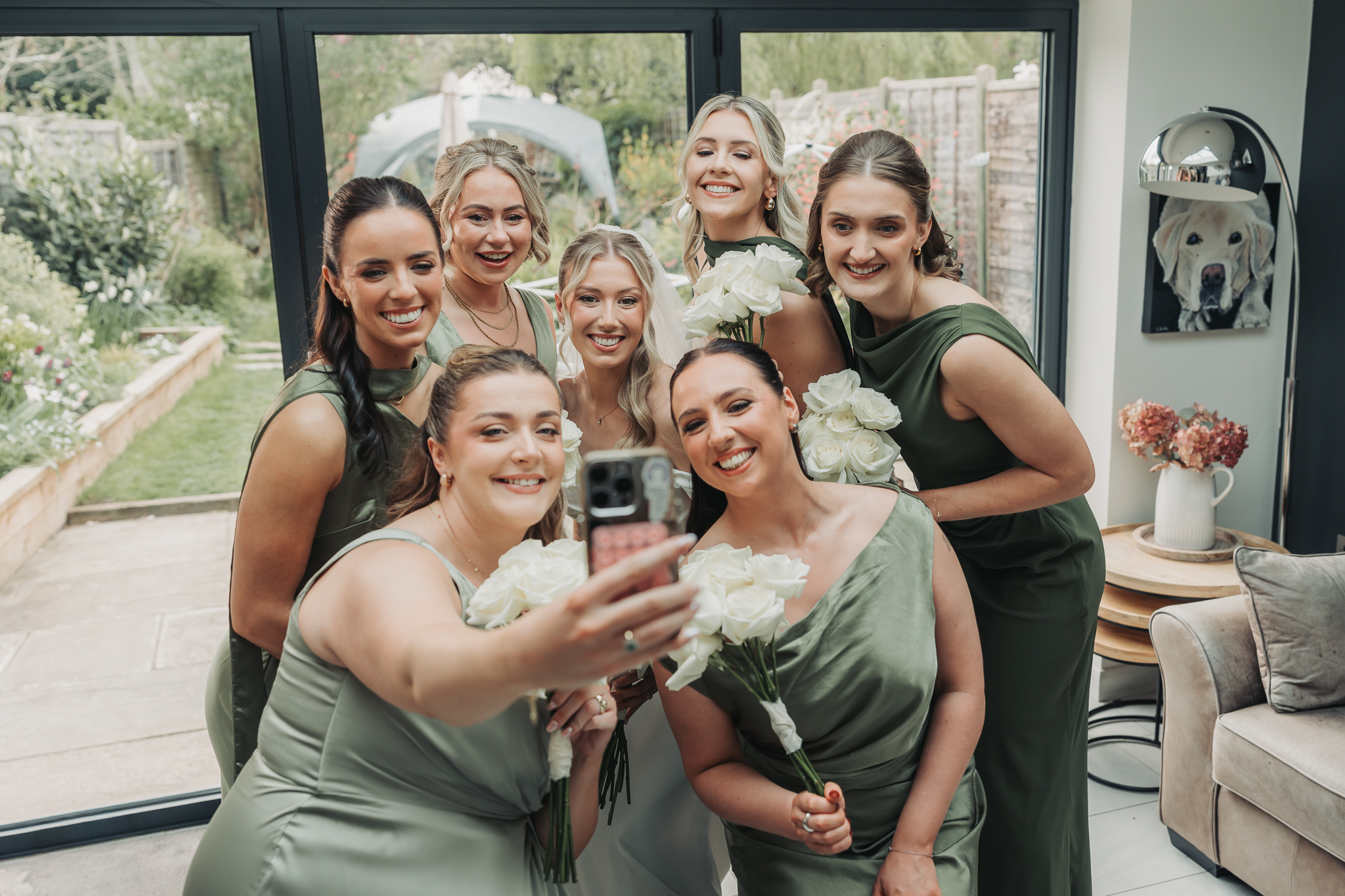 bridesmaids and bride taking selfie