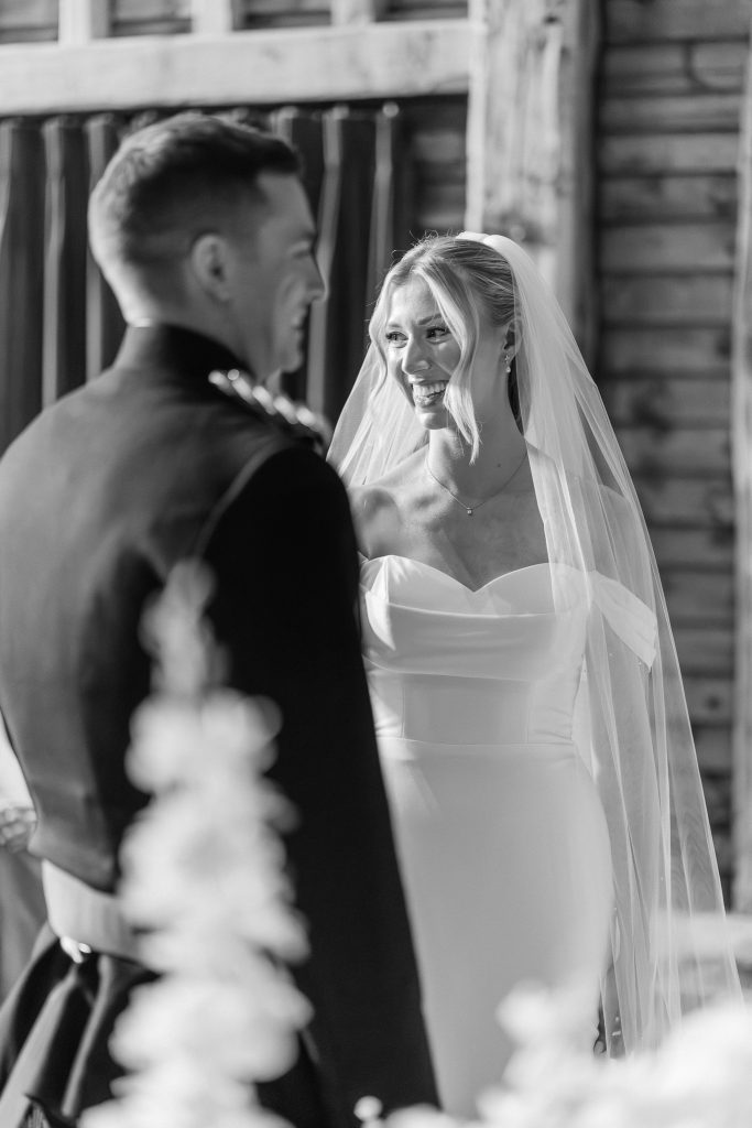 black and white photo of bride smiling