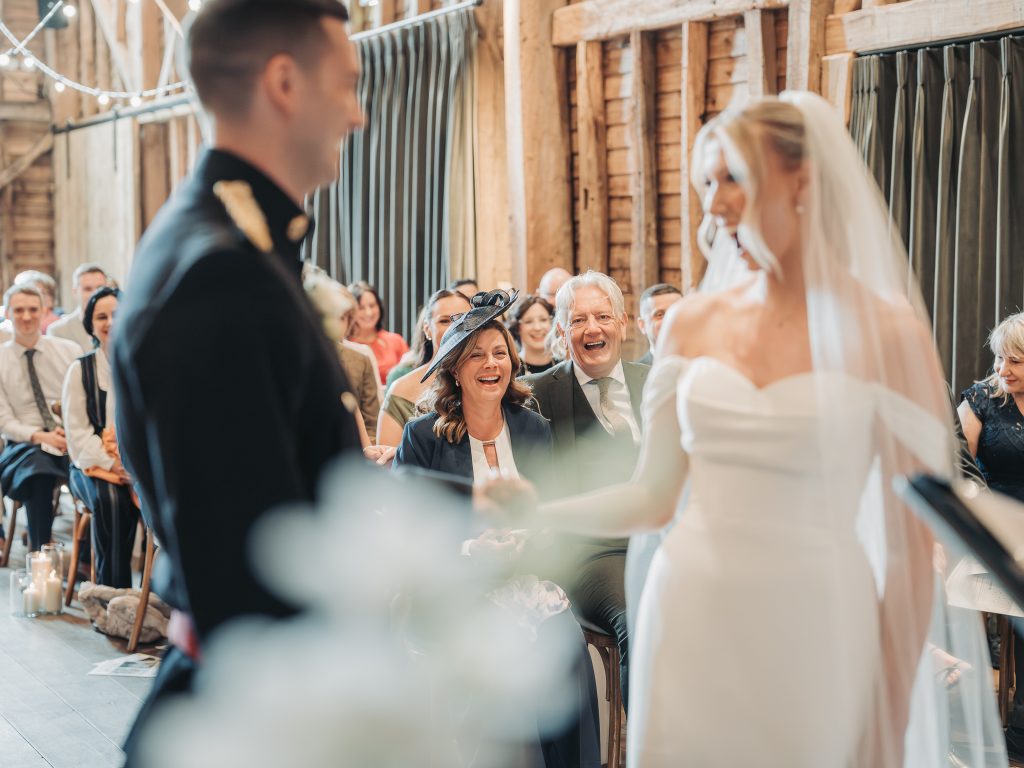 parents smiling during ceremony