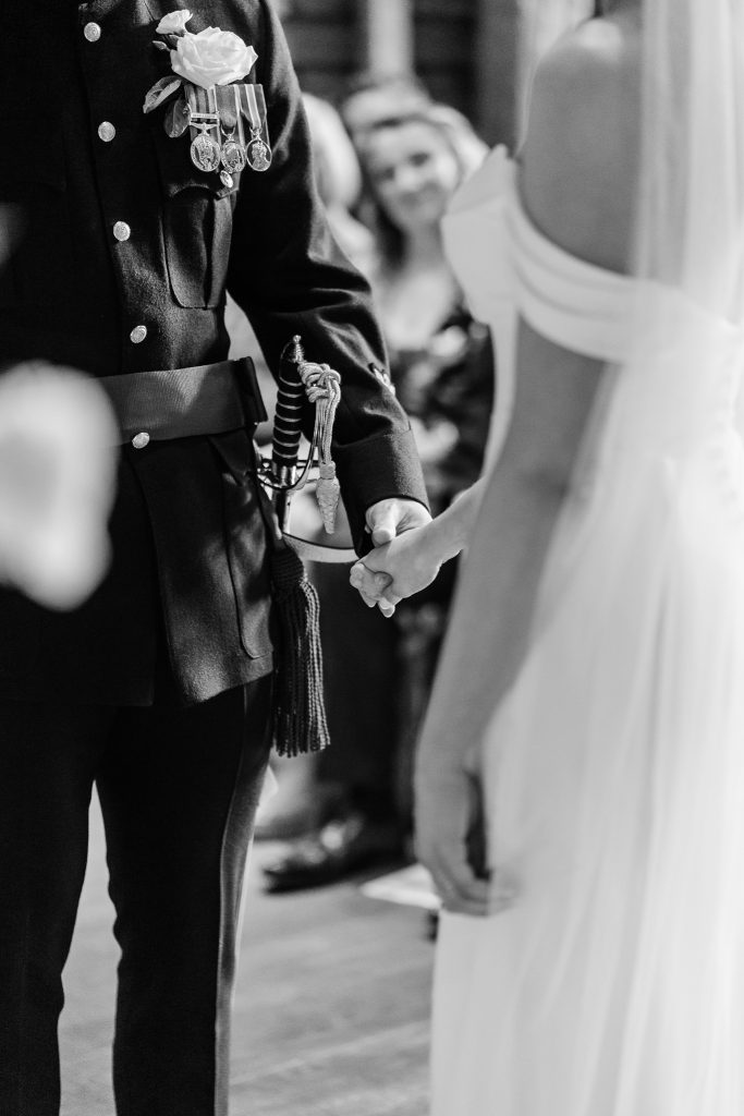 black and white close up of hands holding